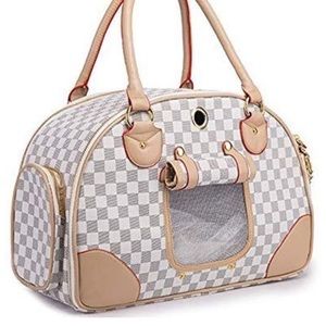 Dog bag/purse. Looks like Louis Vuitton pattern
